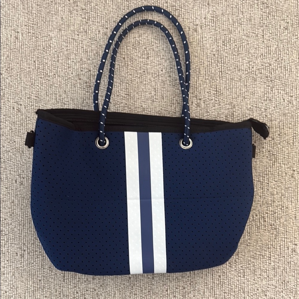 Stylish Navy Blue Neoprene Tote Bag with wristlet and crossbody strap.